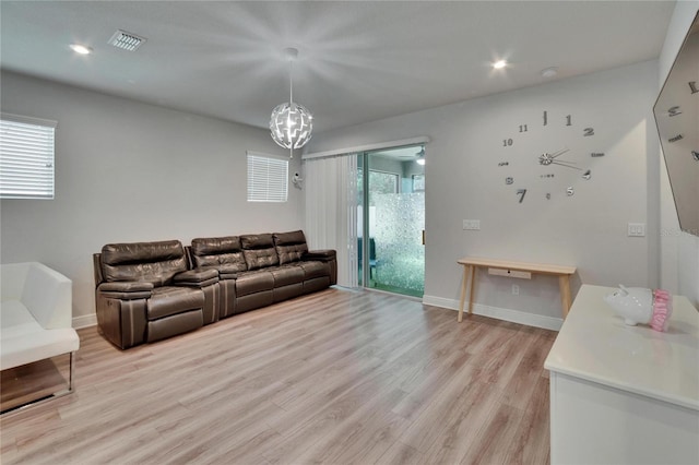 living room with visible vents, light wood-style flooring, recessed lighting, and baseboards