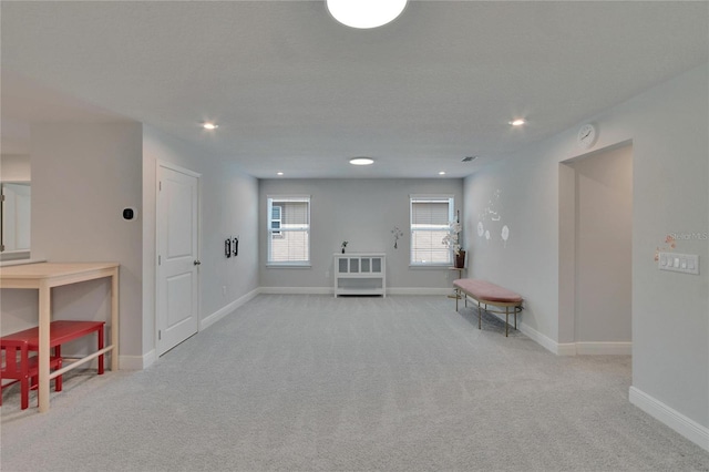 interior space featuring baseboards, recessed lighting, and carpet flooring