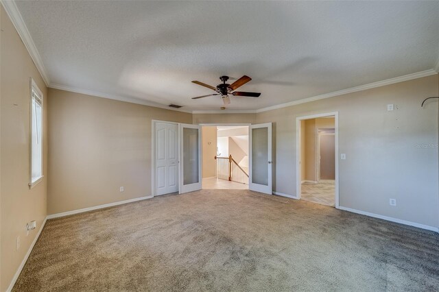 11386 Churchhill Trl, Seminole, FL 33772 - unfurnished bedroom with crown molding, visible vents, carpet flooring, and a textured ceiling