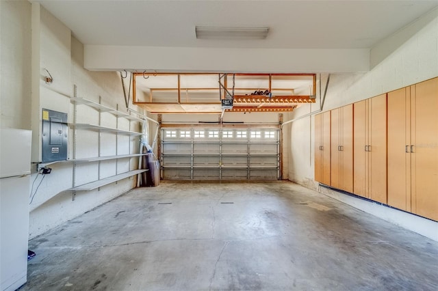 11386 Churchhill Trl, Seminole, FL 33772 - garage featuring electric panel, a garage door opener, and freestanding refrigerator