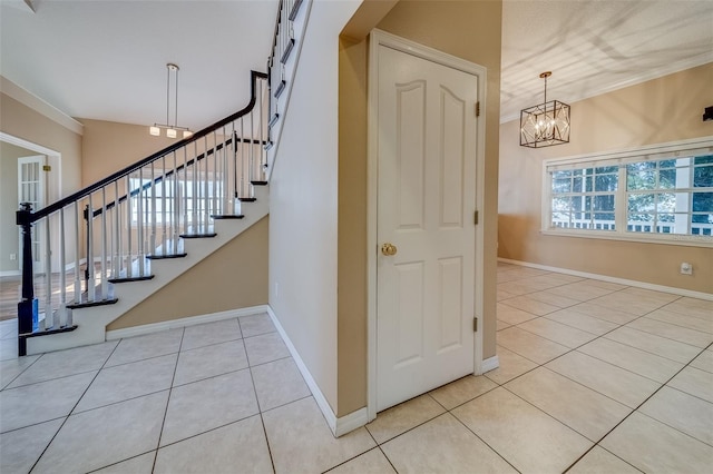 11386 Churchhill Trl, Seminole, FL 33772 - staircase with tile patterned flooring, a notable chandelier, baseboards, and crown molding