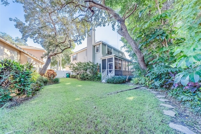 11386 Churchhill Trl, Seminole, FL 33772 - view of yard with a sunroom and fence
