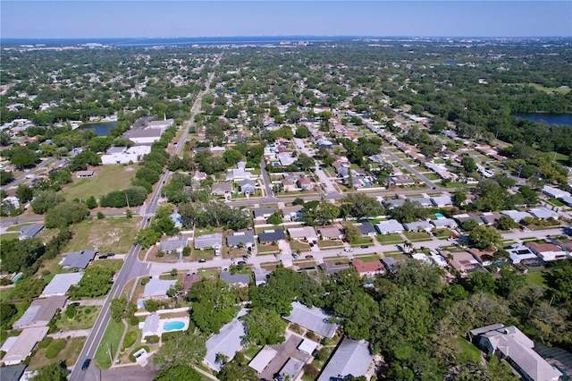 drone / aerial view featuring a water view and a residential view