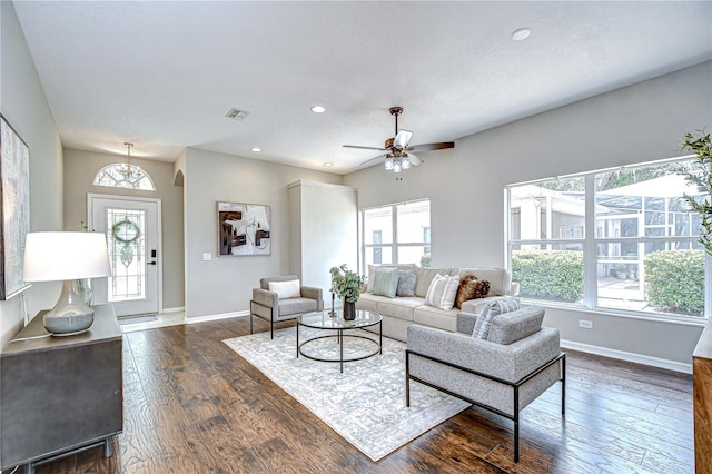 16501 Sandhill Crane Dr, Spring Hill, FL 34610 - living area featuring baseboards, dark wood-style floors, healthy amount of natural light, and recessed lighting