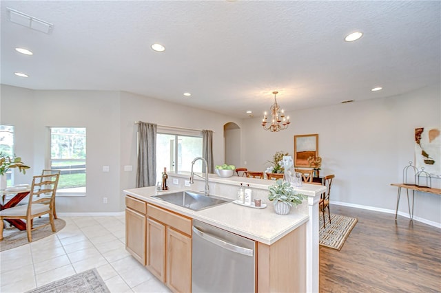 16501 Sandhill Crane Dr, Spring Hill, FL 34610 - kitchen featuring stainless steel dishwasher, a sink, light brown cabinets, light countertops, and recessed lighting