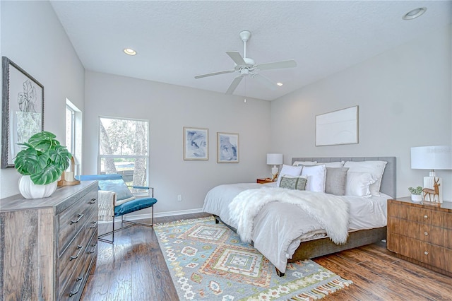 16501 Sandhill Crane Dr, Spring Hill, FL 34610 - bedroom with dark wood-style flooring, recessed lighting, baseboards, ceiling fan, and a textured ceiling