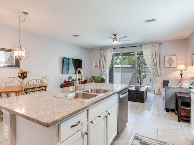 kitchen featuring a sink, open floor plan, visible vents, dishwasher, and light tile patterned floors