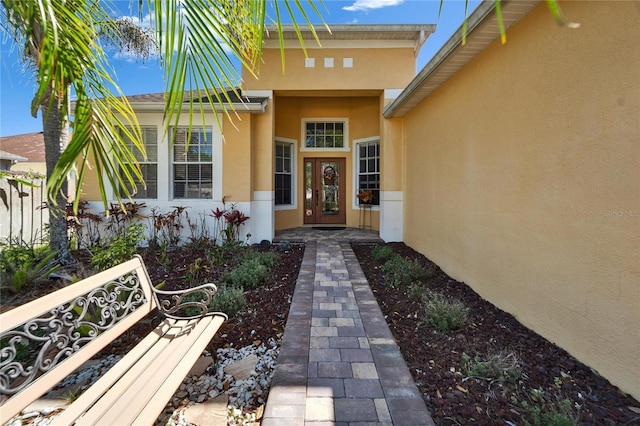 doorway to property with stucco siding
