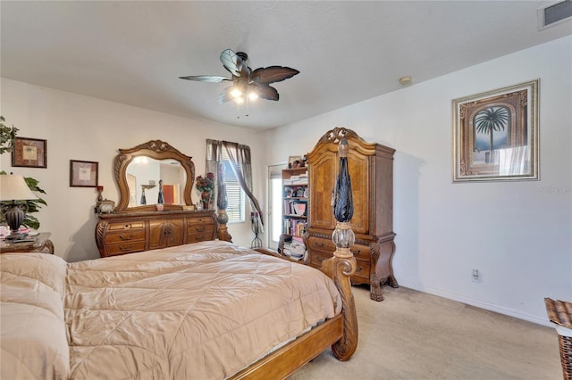 bedroom featuring light carpet, a ceiling fan, and baseboards
