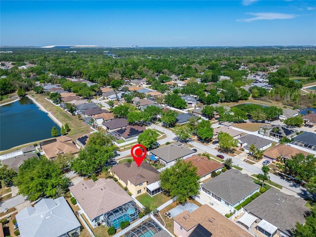 aerial view of residential area featuring a nearby body of water