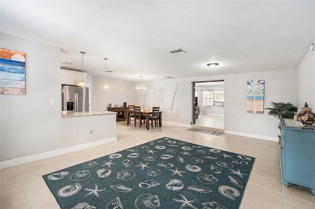 831 72nd Ave N, Saint Petersburg, FL 33702 - entrance foyer featuring a chandelier, light tile patterned floors, baseboards, and visible vents