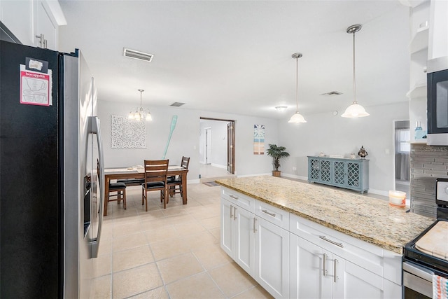 831 72nd Ave N, Saint Petersburg, FL 33702 - kitchen featuring a notable chandelier, light tile patterned flooring, white cabinets, visible vents, and stainless steel appliances