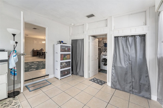 831 72nd Ave N, Saint Petersburg, FL 33702 - bathroom featuring washer / clothes dryer, tile patterned flooring, and visible vents