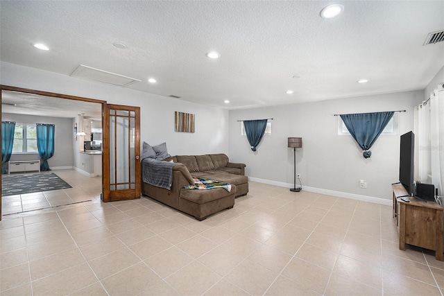 831 72nd Ave N, Saint Petersburg, FL 33702 - living area with visible vents, baseboards, recessed lighting, and attic access