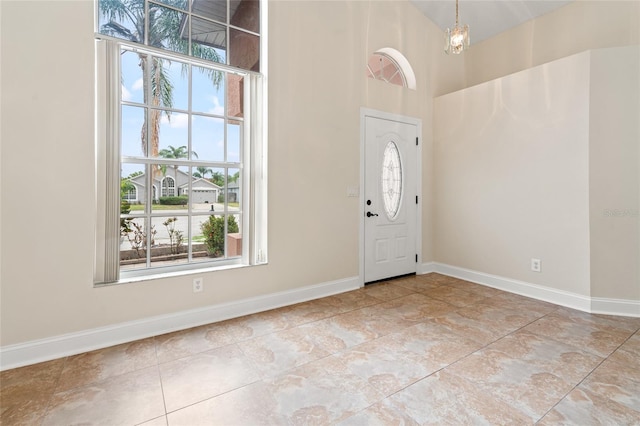 18005 Palm Breeze Dr, Tampa, FL 33647 - tiled foyer entrance featuring baseboards and a high ceiling