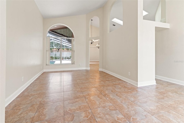 18005 Palm Breeze Dr, Tampa, FL 33647 - tiled empty room with baseboards and a high ceiling