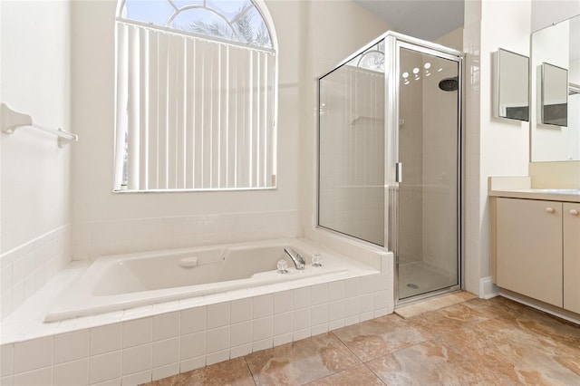 18005 Palm Breeze Dr, Tampa, FL 33647 - full bathroom with a shower stall, vanity, and a garden tub