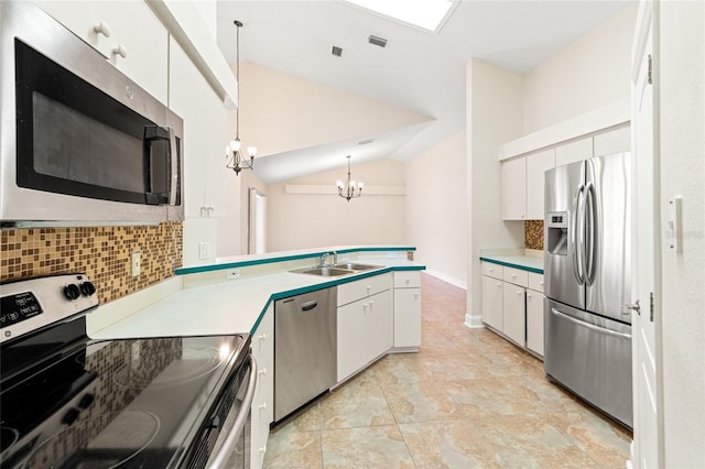 18005 Palm Breeze Dr, Tampa, FL 33647 - kitchen featuring tasteful backsplash, an inviting chandelier, a sink, vaulted ceiling, and stainless steel appliances