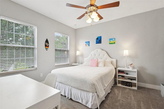 carpeted bedroom with baseboards and ceiling fan