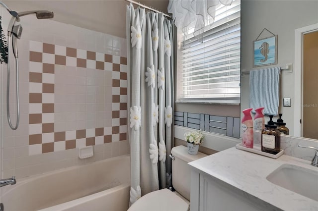 bathroom with vanity, toilet, and shower / bath combo