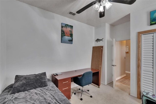 bedroom with light colored carpet, baseboards, a ceiling fan, and visible vents