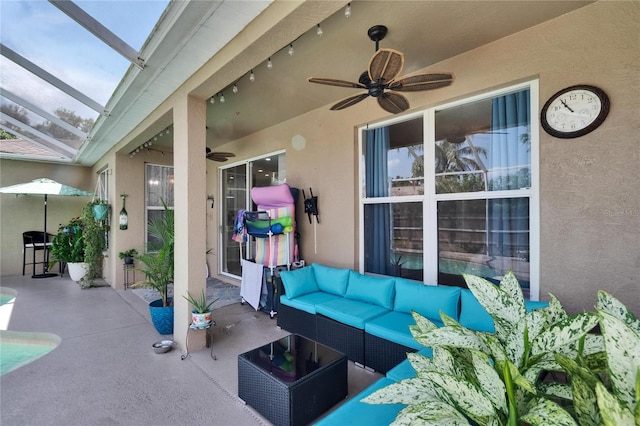 view of patio / terrace with a lanai, outdoor lounge area, and a ceiling fan
