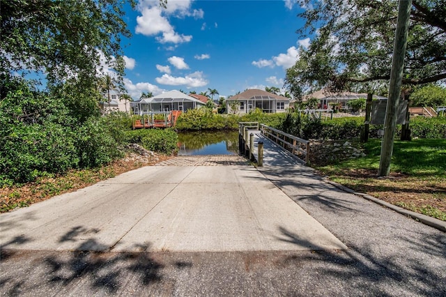 view of street with a water view and a residential view