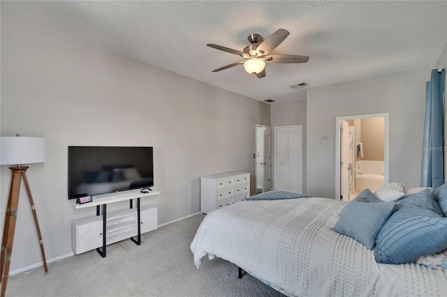 bedroom featuring a textured ceiling, visible vents, light carpet, a ceiling fan, and baseboards