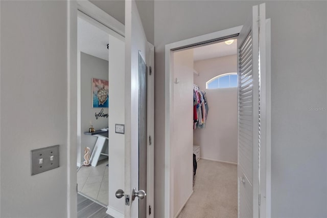 hall featuring baseboards