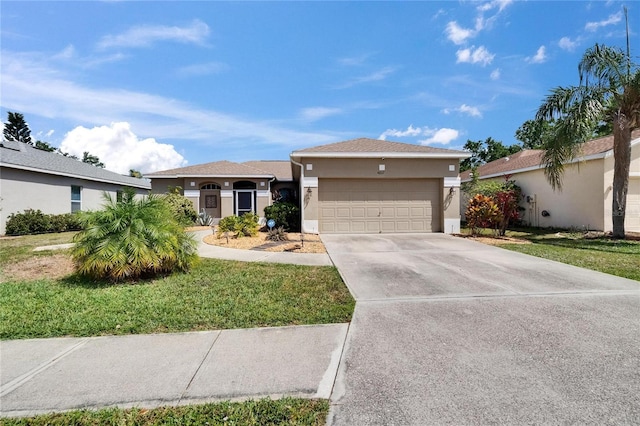 ranch-style house featuring driveway, stucco siding, a garage, and a front yard
