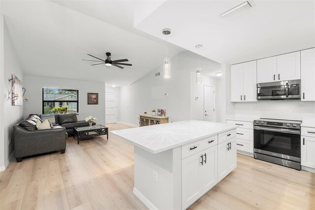 1047 Deer Hollow Way, Sarasota, FL 34232 - kitchen with open floor plan, visible vents, lofted ceiling, ceiling fan, and appliances with stainless steel finishes