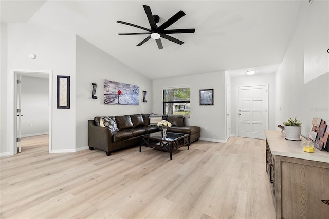 1047 Deer Hollow Way, Sarasota, FL 34232 - living room with high vaulted ceiling, ceiling fan, baseboards, and light wood-style flooring