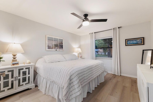 1047 Deer Hollow Way, Sarasota, FL 34232 - bedroom featuring light wood-style flooring, baseboards, and a ceiling fan