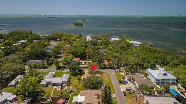 drone / aerial view featuring a water view and a residential view