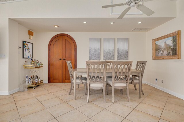4490 38th Way S, Saint Petersburg, FL 33711 - dining room featuring ceiling fan, arched walkways, visible vents, recessed lighting, and light tile patterned flooring