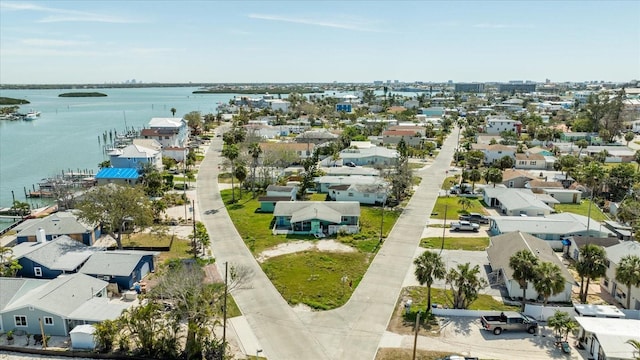 birds eye view of property featuring a residential view and a water view