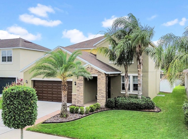 mediterranean / spanish-style home featuring a garage, driveway, stucco siding, and a front lawn