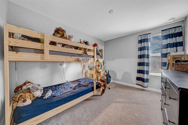bedroom with baseboards and carpet flooring