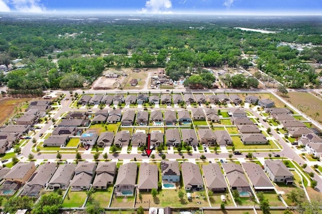 1214 Florablu Dr, Seffner, FL 33584 - aerial view of residential area with a heavily wooded area
