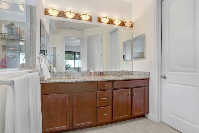 1214 Florablu Dr, Seffner, FL 33584 - full bathroom with double vanity and tile patterned flooring