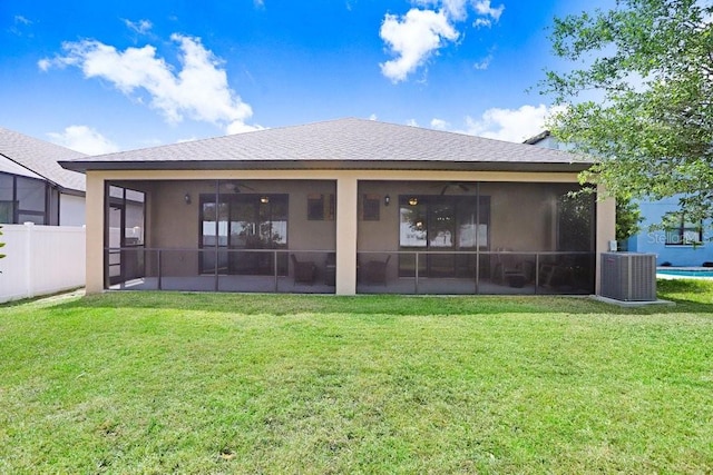 1214 Florablu Dr, Seffner, FL 33584 - rear view of property featuring a shingled roof, a sunroom, and stucco siding