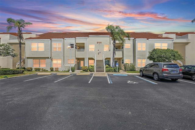 6191 Bahia Del Mar Blvd Unit 204, Saint Petersburg, FL 33715 - property at dusk featuring uncovered parking