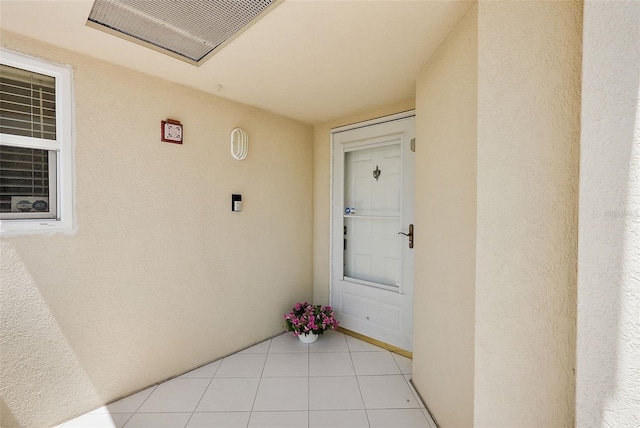 6191 Bahia Del Mar Blvd Unit 204, Saint Petersburg, FL 33715 - view of exterior entry with visible vents and stucco siding