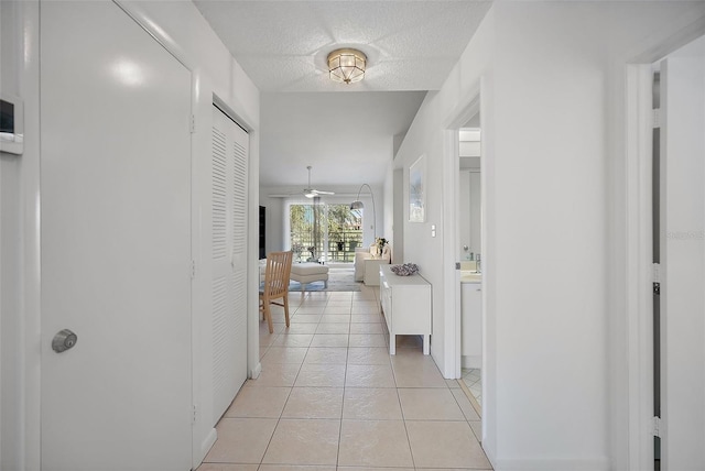 6191 Bahia Del Mar Blvd Unit 204, Saint Petersburg, FL 33715 - hallway with a textured ceiling and light tile patterned floors