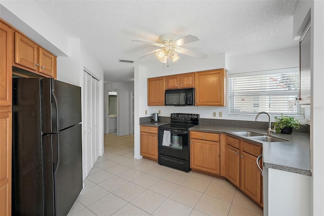 6191 Bahia Del Mar Blvd Unit 204, Saint Petersburg, FL 33715 - kitchen with ceiling fan, visible vents, black appliances, a sink, and dark countertops
