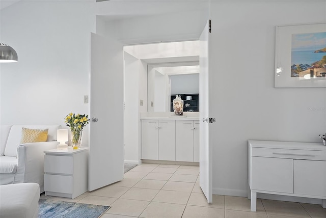 6191 Bahia Del Mar Blvd Unit 204, Saint Petersburg, FL 33715 - hallway featuring light tile patterned floors and baseboards