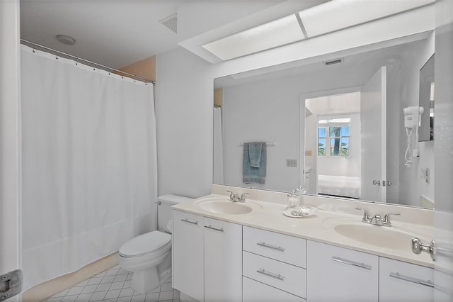 6191 Bahia Del Mar Blvd Unit 204, Saint Petersburg, FL 33715 - bathroom featuring double vanity, a shower with curtain, a sink, and toilet