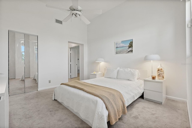 6191 Bahia Del Mar Blvd Unit 204, Saint Petersburg, FL 33715 - bedroom featuring baseboards, light carpet, a towering ceiling, and visible vents