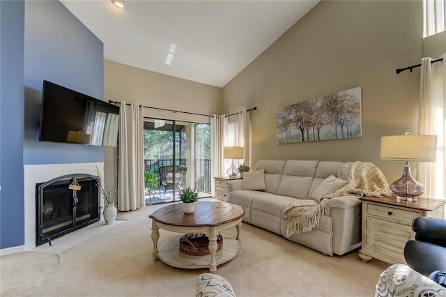 612 Fairmont Ave Unit D, Safety Harbor, FL 34695 - carpeted living room with high vaulted ceiling and a fireplace