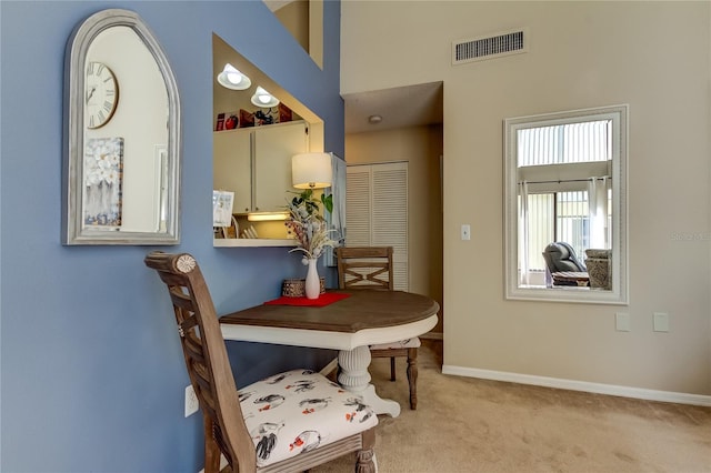 612 Fairmont Ave Unit D, Safety Harbor, FL 34695 - carpeted dining space with visible vents and baseboards